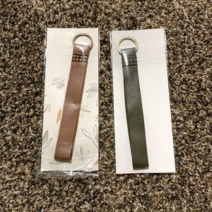 Two Mercy House Global Leather Keychains